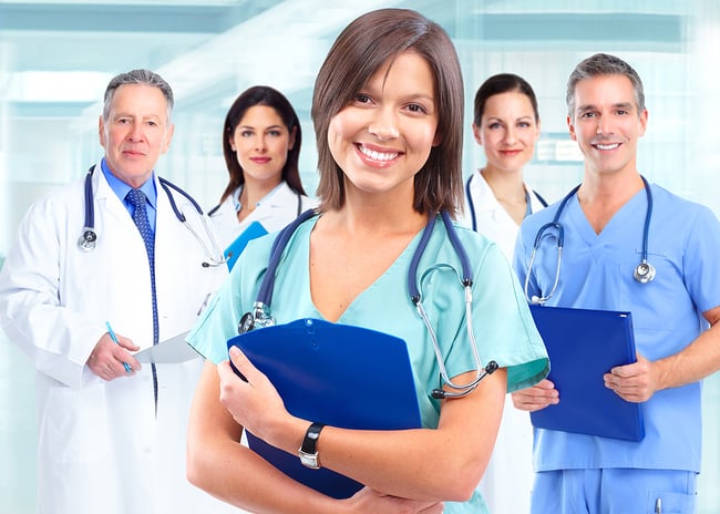 Medical assistant standing in front of a medical team.