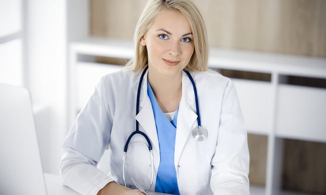 bigstock-Portrate-Of-Woman-doctor-At-Wo-412446451